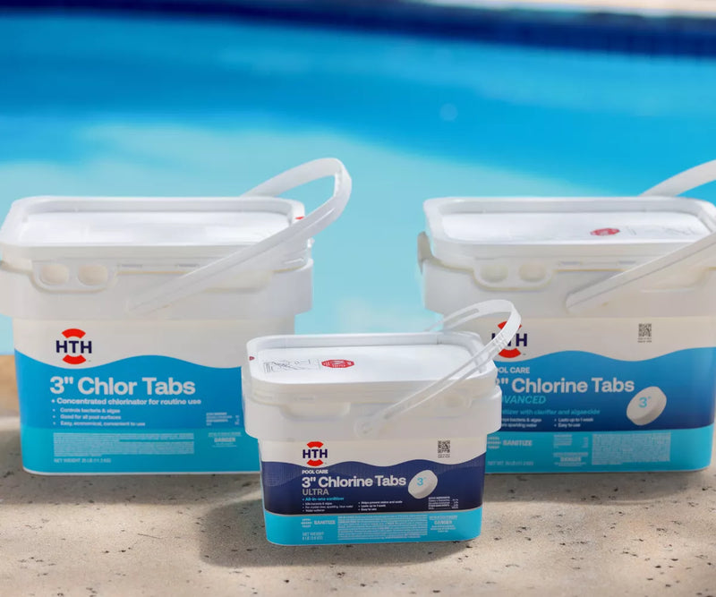 HTH 3 inch chlorine tablets in buckets displayed poolside for swimming pool sanitation
