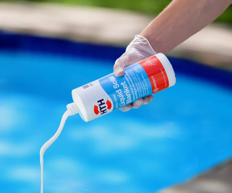 HTH liquid solar blanket pool product being poured into swimming pool water during routine maintenance
