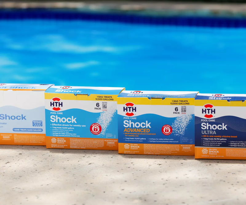 HTH pool shock products displayed beside a swimming pool for water treatment
