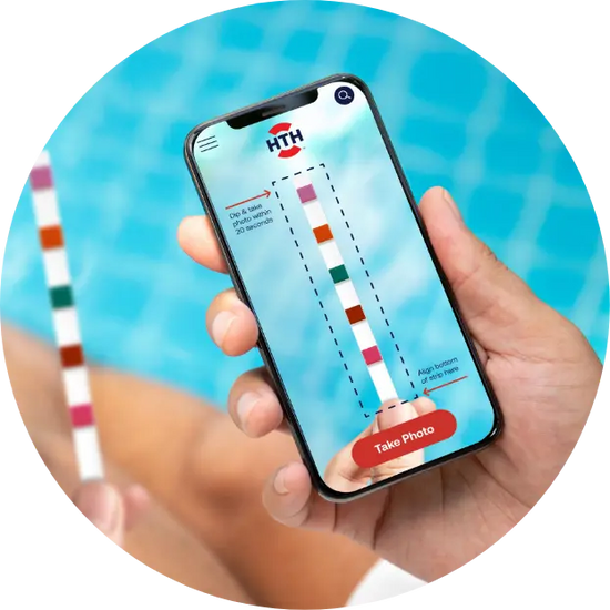 hand holding phone scanning hth pool and spa test strip