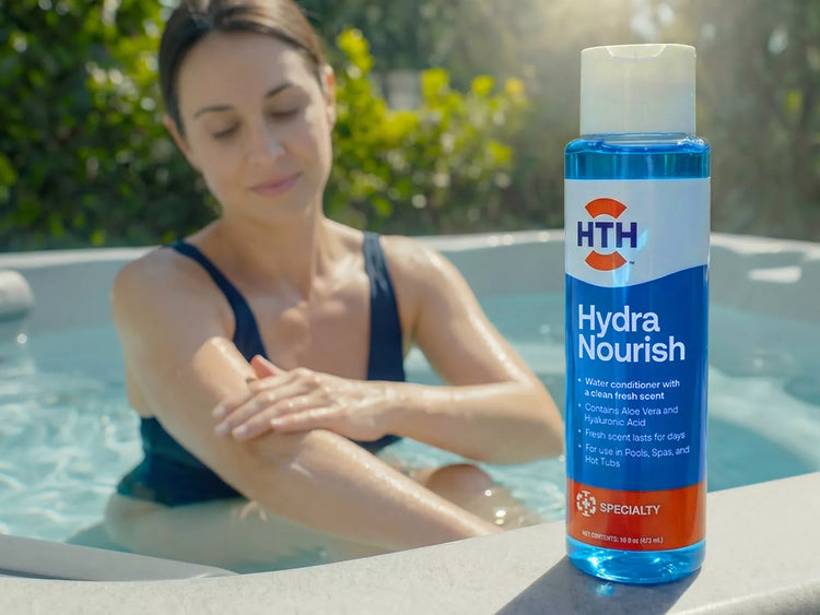 HTH Hydra Nourish water conditioner bottle featuring aloe vera and hyaluronic acid, held by a woman sitting in a hot tub.